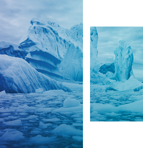 Icebergs breaking apart on the ocean.