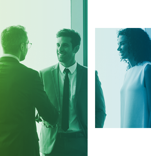 Two men in business attire shake hands. 