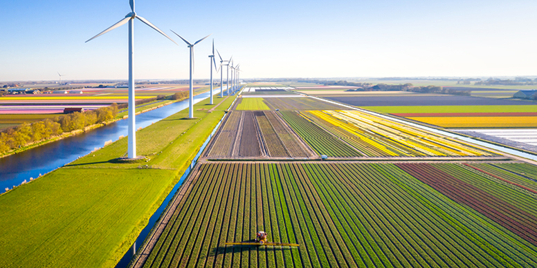 An ariel view of several farms and windmills