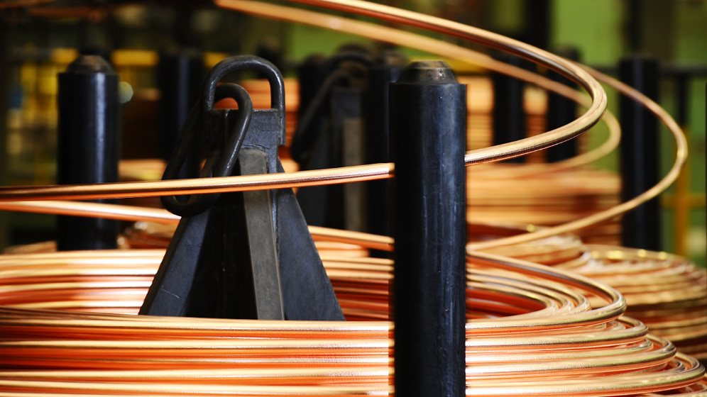 Copper being wound onto an industrial spool. 