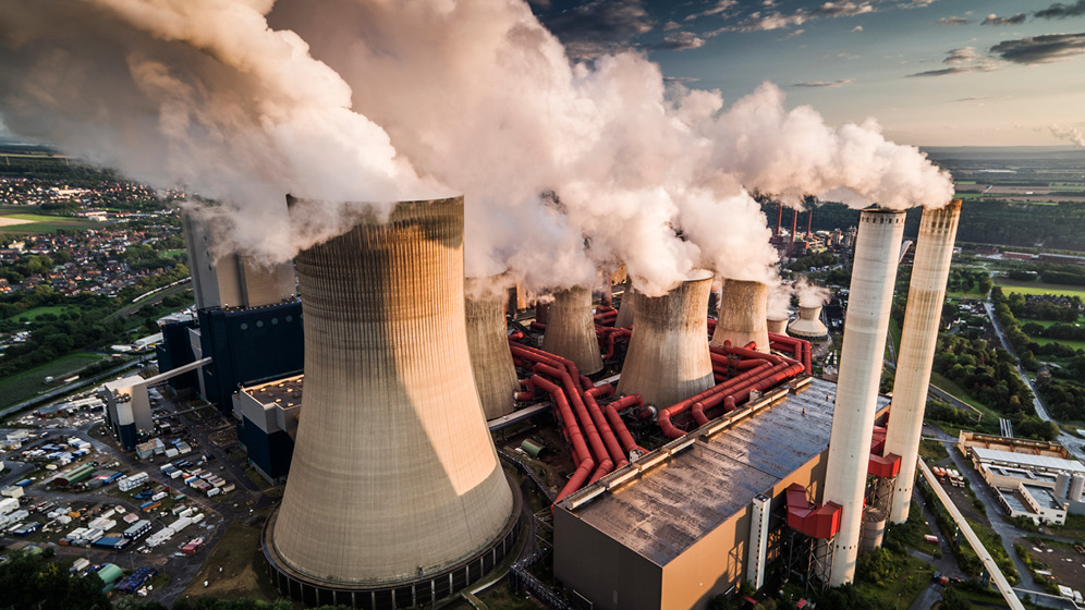 Aerial view of giant smokestacks.