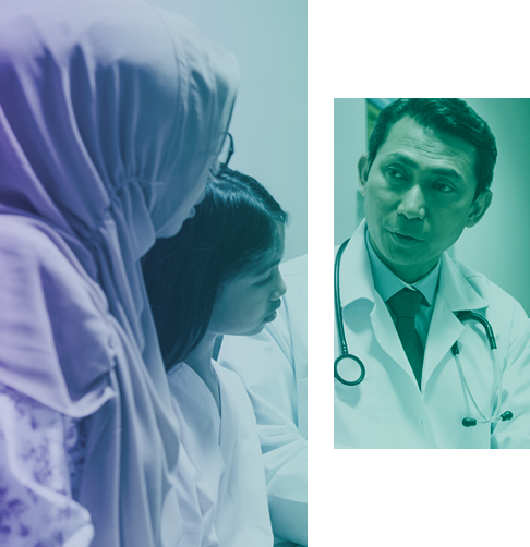 A doctor is speaking with a mother and her daughter.